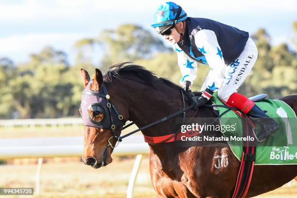 Dean Yendall returns to the mounting yard aboard Rikibobby after winning the Farewell Terry Bailey BM58 Handicap at Mildura Racecourse on July 09,...