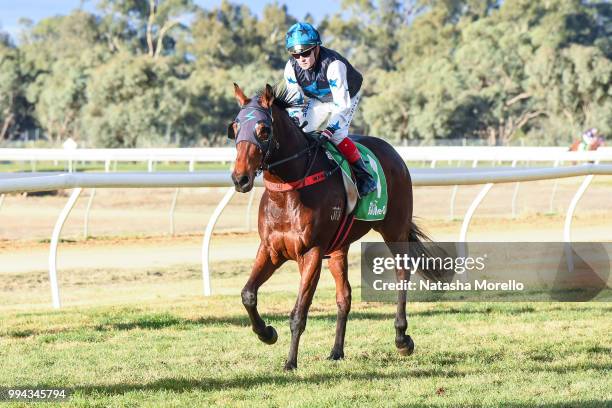 Dean Yendall returns to the mounting yard aboard Rikibobby after winning the Farewell Terry Bailey BM58 Handicap at Mildura Racecourse on July 09,...