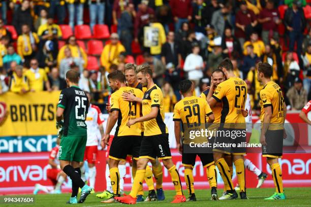 Dresden's players celebrate the 0-2 victory over Regensburg together with the fans after the German Second Bundesliga soccer match between Jahn...