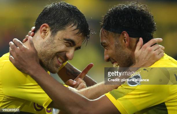 Dpatop - Sokratis and Pierre-Emerick Aubameyang of Dortmund celebrate the goal making it 4:0 during the German Bundesliga football match between...