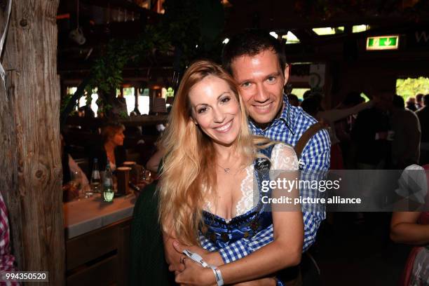 Television presenter Andrea Kaiser and her husband Sebastien Ogier in the Käferzelt on the first Sunday of this year's Oktoberfest in Munich,...