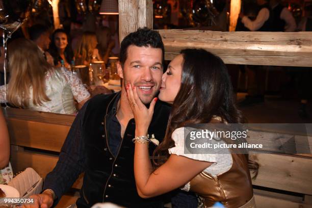 Retired German soccer player Michael Ballack with his partner Natacha Tannous on the first Sunday of this year's Oktoberfest in Munich, Germany, 17...