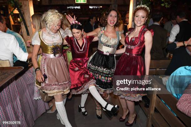 Photographer Ellen von Unwerth, Dirndl designer Lola Paltinger and model Barbara Meier on the first Sunday of this year's Oktoberfest in Munich,...