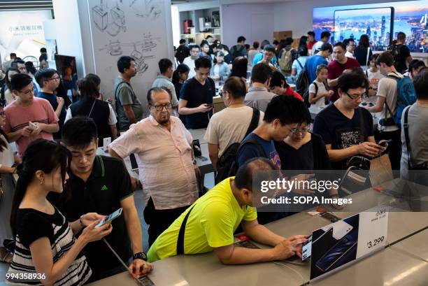 Visitors and buyers interested in digital Xiaomi smartphone at its flagship store in Mong Kok, Hong Kong. Chinese mobile phone and technology giant...