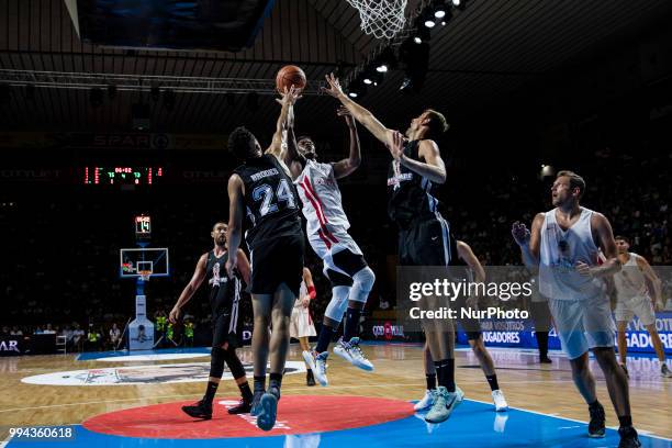 Jimmy Butler from United States of America of Minnesota Timberwolves defended by Dillon Brooks from Canada of Memphis Grizzlies during the charity...