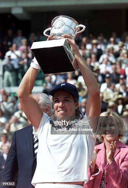 Jennifer Capriati of the USA celebrates with the trophy after winning the womens final match against Kim Clijsters of Belgium during the French Open...