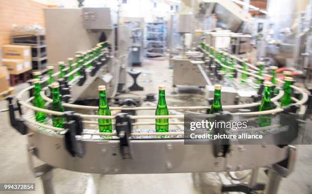 Bottles of sparkling wine at a vineyard bottling plant near Heilbronn, Germany, 14 September 2017. Photo: Sebastian Gollnow/dpa