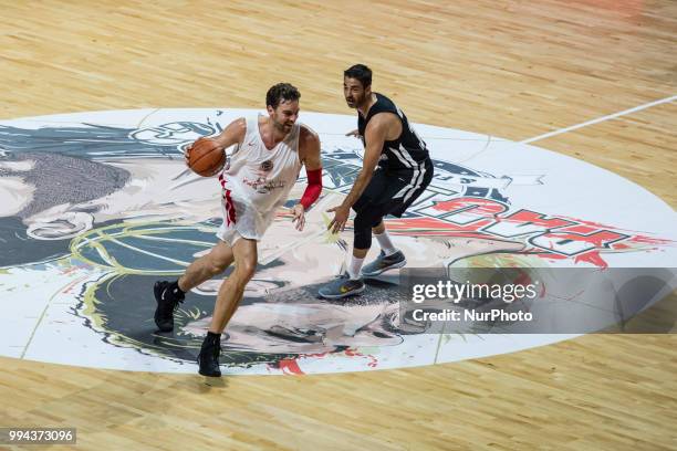 Pau Gasol from Spain of San Antonio Spurs defended by Juan Carlos Navarro from Spain exFC Barcelona Lassa player during the charity and friendly...