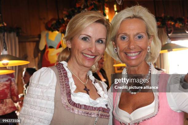 Elisabeth Grupp , wfie of businessman Wolfgang Grupp and Kristina Troeger, initiator and president of the Club European Business women pose at the...