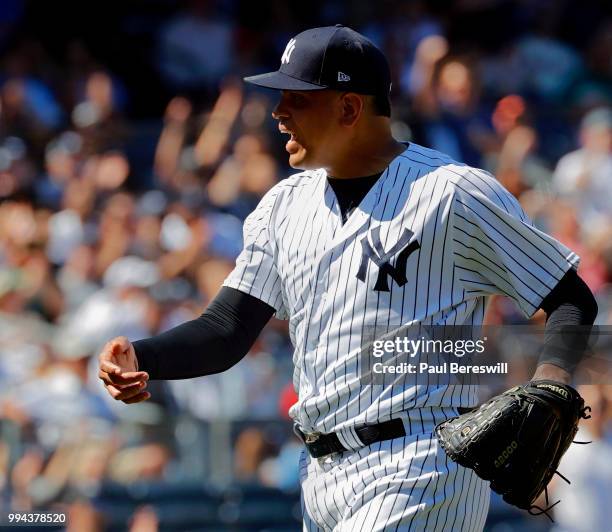 Pitcher Dellin Betances of the New York Yankees reacts after the last out of the 8th inning of an MLB baseball game against the Seattle Mariners on...