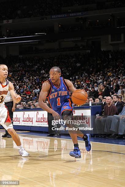 Chris Duhon of the New York Knicks drives to the basket against Stephen Curry of the Golden State Warriors during the game at Oracle Arena on April...