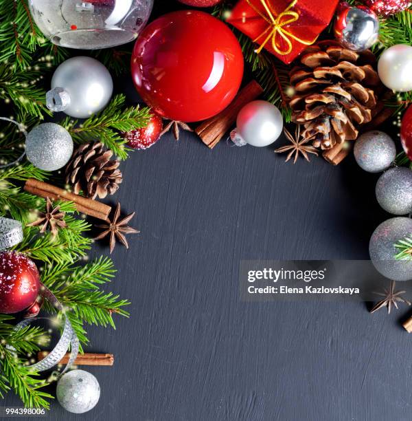 christmas and new year decoration on black wooden background - black christmas stockfoto's en -beelden