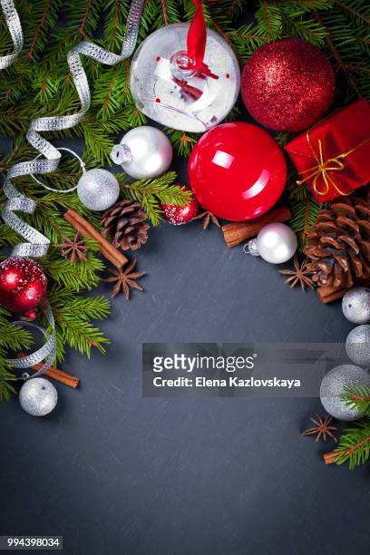 christmas and new year decoration on black wooden background - black christmas stockfoto's en -beelden