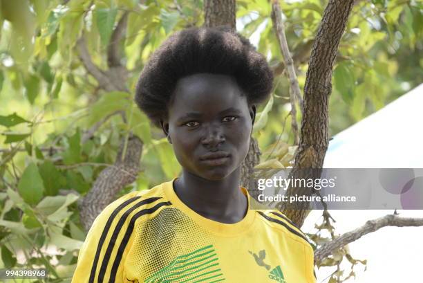 The 17 year old Christine from South Sudan can be seen next to her hut in the refugee settlement in Imvepi, Uganda, 27 June 2017. More than two...