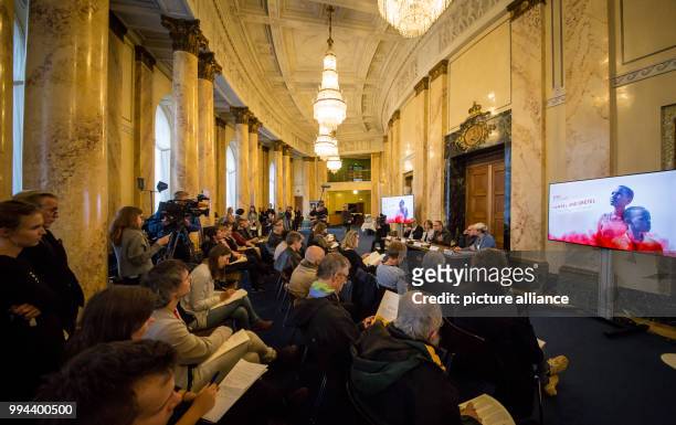 Journalists sit to be informed on current developments of the opera piece "Hansel and Gretel" in Stuttgart, Germany, 19 September 2017. The director...