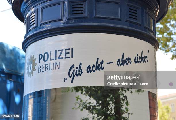 An advertisement of the police: "Polizei Berlin. Gib acht - aber sicher" can be seen near the police headquarters at the Platz der Luftbruecke in...