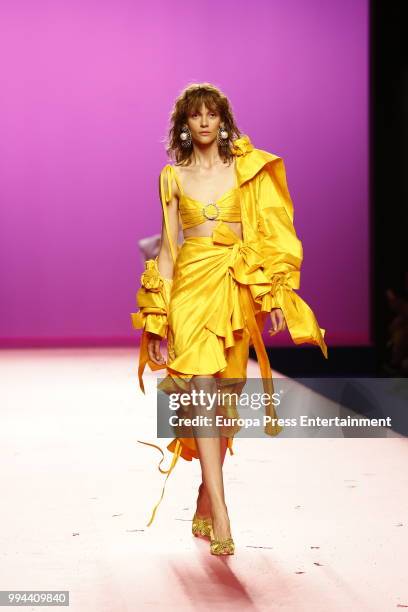 Model walks the runway during Maria Escote show at Mercedes Benz Fashion Week Madrid Spring/ Summer 2019 on July 8, 2018 in Madrid, Spain. On July 8,...