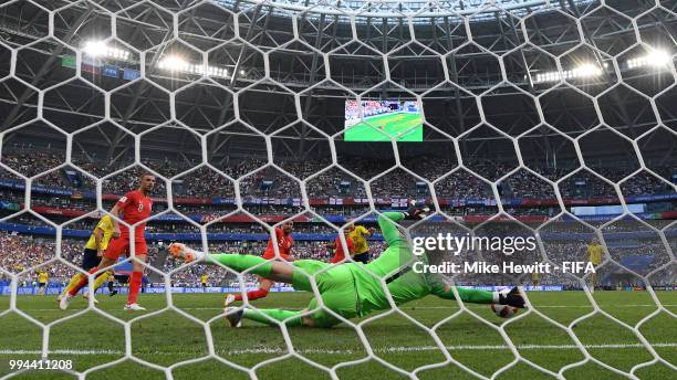 Jordan Pickford of England saves a shot from Viktor Claesson of Sweden during the 2018 FIFA World Cup Russia Quarter Final match between Sweden and...