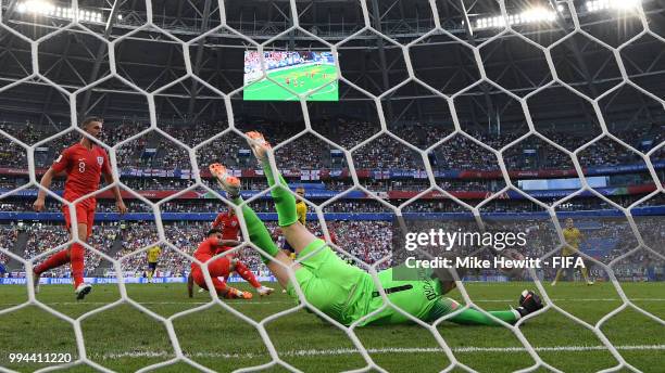 Jordan Pickford of England saves a shot from Viktor Claesson of Sweden during the 2018 FIFA World Cup Russia Quarter Final match between Sweden and...