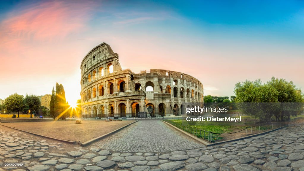 Colosseum in Rome and morning sun, Italy