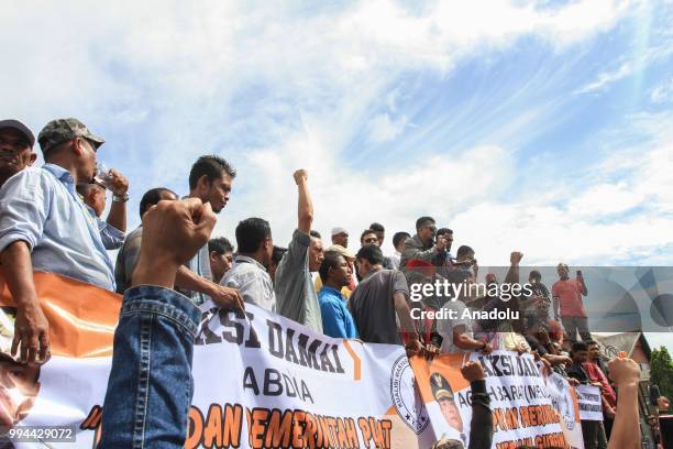 Supporters of the Aceh Community Coalition hold a demonstration in front of Baiturrahman Mosque, at Banda Aceh City, Aceh, Indonesia on Monday, July...