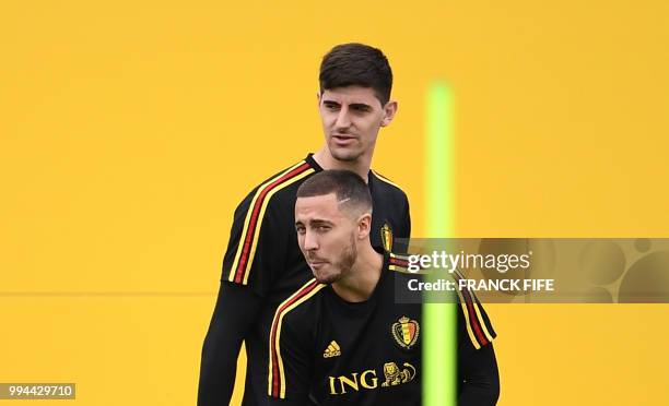 Belgium's goalkeeper Thibaut Courtois and Belgium's forward Eden Hazard attend a training session at the Guchkovo Stadium in Dedovsk, outside Moscow,...