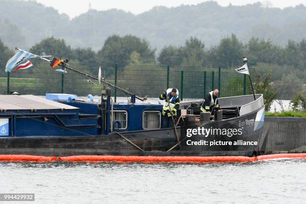 Freight barge on the River Danube near the lock in Straubing, Germany, 20 September 2017. After a leak in the engine room, the fire service pumped...