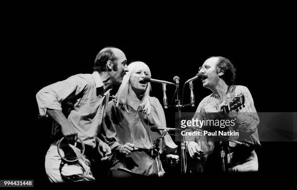 Folk group Peter, Paul, & Mary, left to right, Peter Yarrow, Mary Travers and Noel Paul Stookey, perform on stage at the Auditorium Theater in...