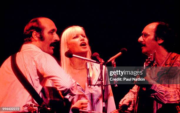 Folk group Peter, Paul, & Mary, left to right, Peter Yarrow, Mary Travers and Noel Paul Stookey, perform on stage at the Auditorium Theater in...