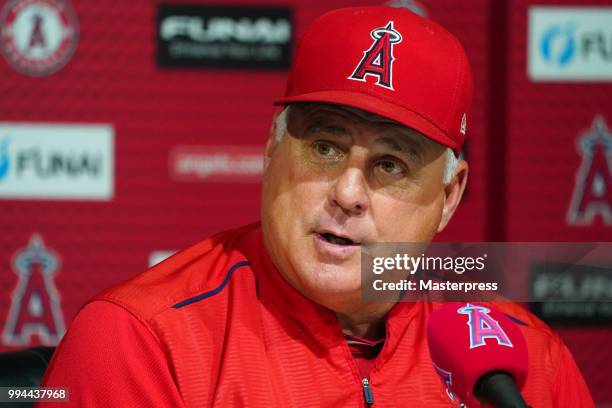 Manager Mike Scioscia of the Los Angeles Angels of Anaheim answers a question at a press conference after his team's game against the Los Angeles...