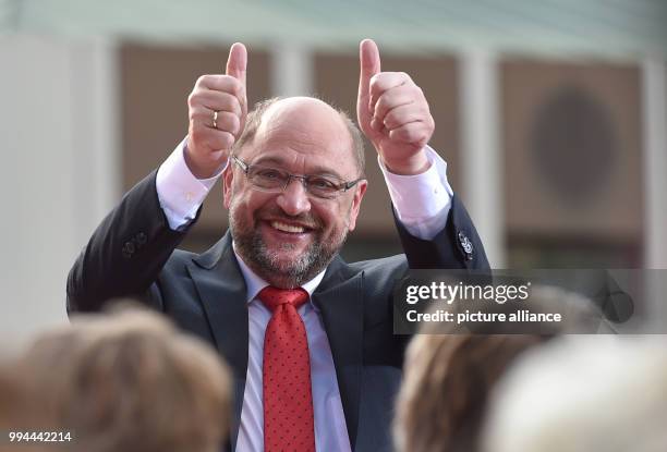 Germany's Social Democratic Party's top candidate Martin Schulz shows thumbs-up during a campaign event of the SPD North Rhine-Westphalia in...