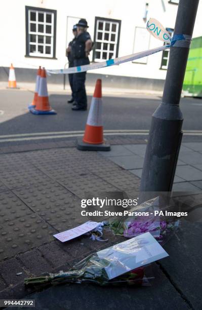 Flowers at the scene in Rollestone Street, Salisbury, where counter-terrorism officers are investigating after Dawn Sturgess died after she and her...