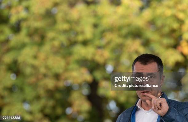 The party chairman of Germany's Buendnis 90/Die Gruenen , Cem Oezdemir speaks during a campaign event on the Schlossplatz square in Stuttgart,...