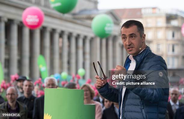 The party chairman of Germany's Buendnis 90/Die Gruenen , Cem Oezdemir speaks during a campaign event on the Schlossplatz square in Stuttgart,...