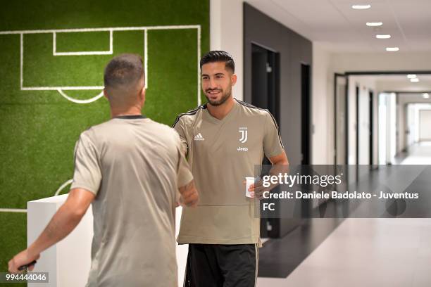 Joao Cancelo and Emre Can attend a Juventus training session at Juventus Training Center on July 9, 2018 in Turin, Italy.