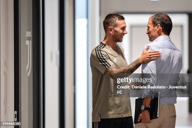 Federico Bernardeschi and Massimiliano Allegri attend a Juventus training session at Juventus Training Center on July 9, 2018 in Turin, Italy.