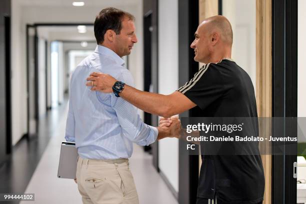 Massimiliano Allegri and Simone Folletti attend a Juventus training session at Juventus Training Center on July 9, 2018 in Turin, Italy.