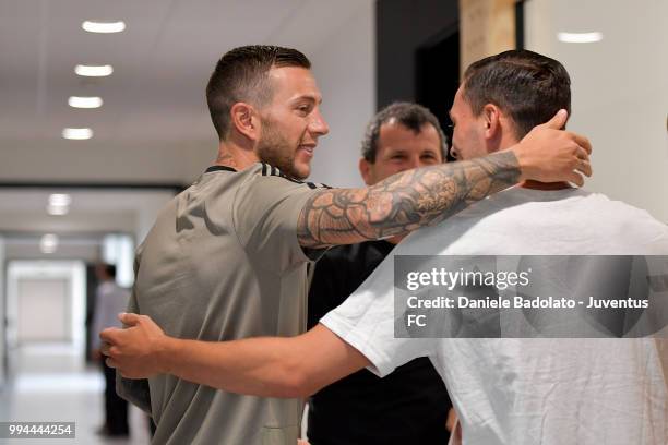 Federico Bernardeschi and Mattia De Sciglio attend a Juventus training session at Juventus Training Center on July 9, 2018 in Turin, Italy.