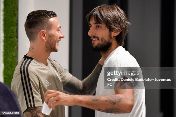 Federico Bernardeschi and Mattia Perin attend a Juventus training session at Juventus Training Center on July 9, 2018 in Turin, Italy.