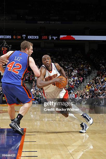 Anthony Tolliver of the Golden State Warriors drives to the basket against David Lee of the New York Knicks during the game at Oracle Arena on April...