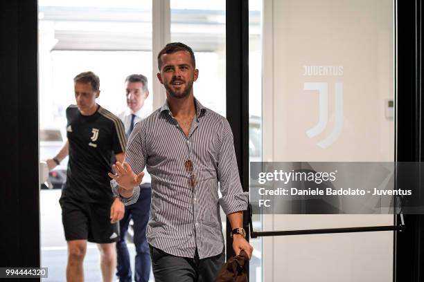Miralem Pjanic attends a Juventus training session at Juventus Training Center on July 9, 2018 in Turin, Italy.