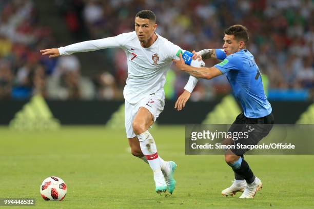 Cristiano Ronaldo of Portugal battles with Lucas Torreira of Uruguay during the 2018 FIFA World Cup Russia Round of 16 match between Uruguay and...