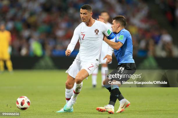 Cristiano Ronaldo of Portugal battles with Lucas Torreira of Uruguay during the 2018 FIFA World Cup Russia Round of 16 match between Uruguay and...