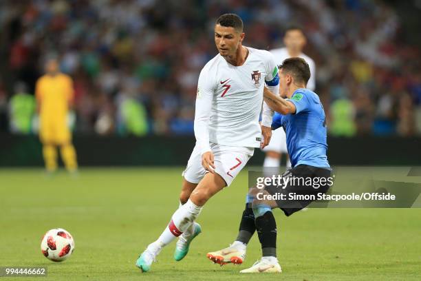 Cristiano Ronaldo of Portugal battles with Lucas Torreira of Uruguay during the 2018 FIFA World Cup Russia Round of 16 match between Uruguay and...