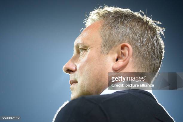 Hanover's coach Andre Breitenreiter watches the warming up of his team prior to the German Bundesliga soccer match between SC Freiburg and Hannover...
