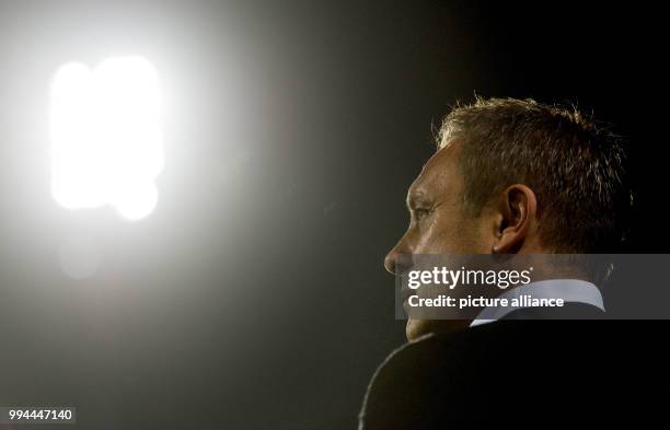 Hanover's coach Andre Breitenreiter watches the warming up of his team prior to the German Bundesliga soccer match between SC Freiburg and Hannover...