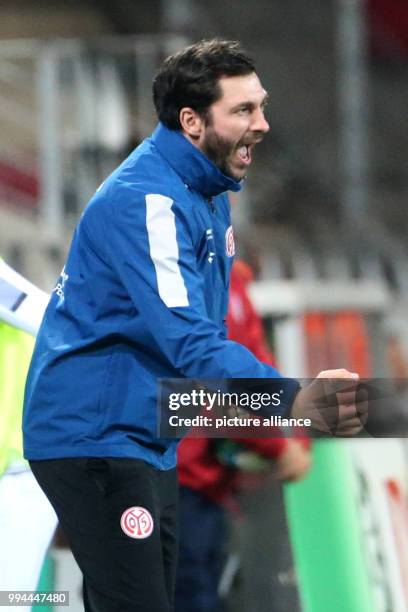 The coach of Mainz, Sandro Schwarz, gestures during the German Bundesliga soccer match between FSV Mainz 05 and 1899 Hoffenheim in the Opel Arena in...