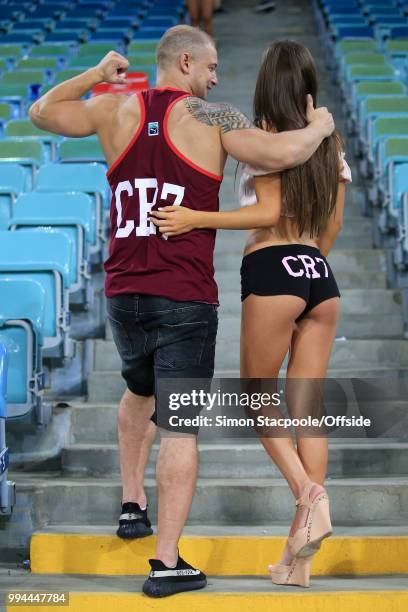 Two Cristiano Ronaldo fans wearing a t-shirt and hot pants emblazoned with his CR7 moniker pose during the 2018 FIFA World Cup Russia Round of 16...