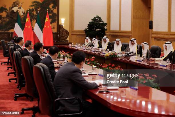 Kuwait's ruling emir, Sheikh Sabah Al Ahmad Al Sabah speaks during a meeting with Chinese President Xi Jinping at the Great Hall of the People on...