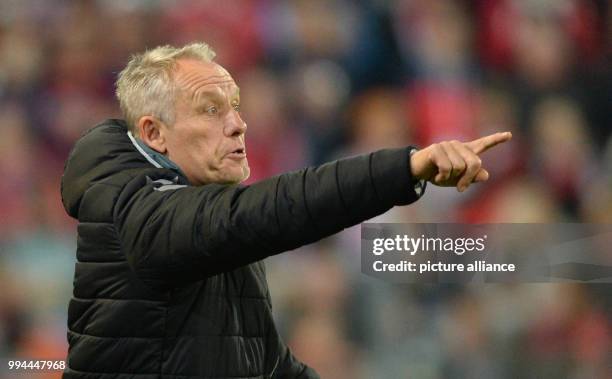 Freiburg's manager Christian Streich gives instructions from the touchline during the German Bundesliga soccer match between SC Freiburg and Hannover...